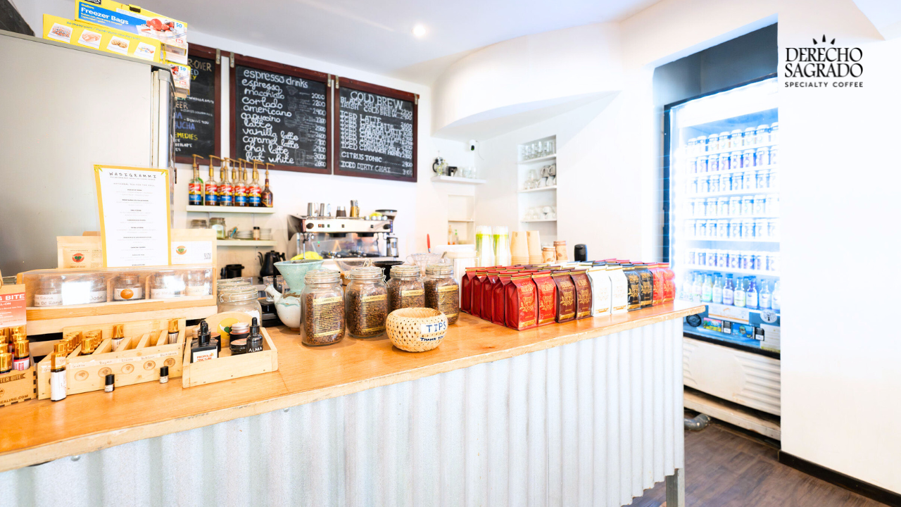 Inside view of Derecho Sagrado Coffee Shop in Tamarindo with prominently displayed logo.